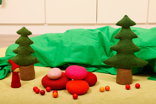 minisland, felt stones, pines, figures, red berries