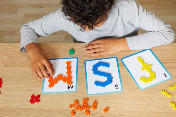 letter cards, alphabet game, colorful letters, wood table, puzzle pieces