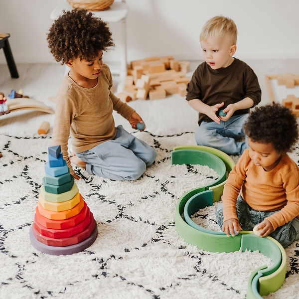 children, toys, wooden blocks, stacking rings, play mat