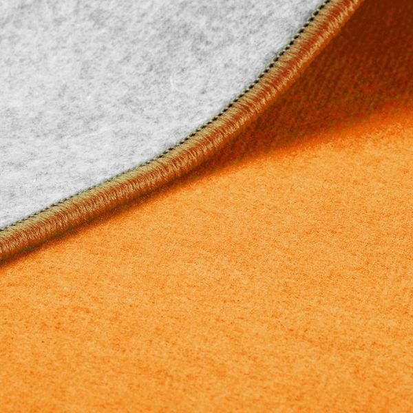 orange Stoff, graue Innenfutter, Nahtkante, weiche Textur, Farbblock