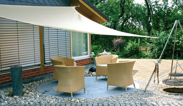 outdoor furniture, patio set, wicker chairs, sun shade sail, stone patio