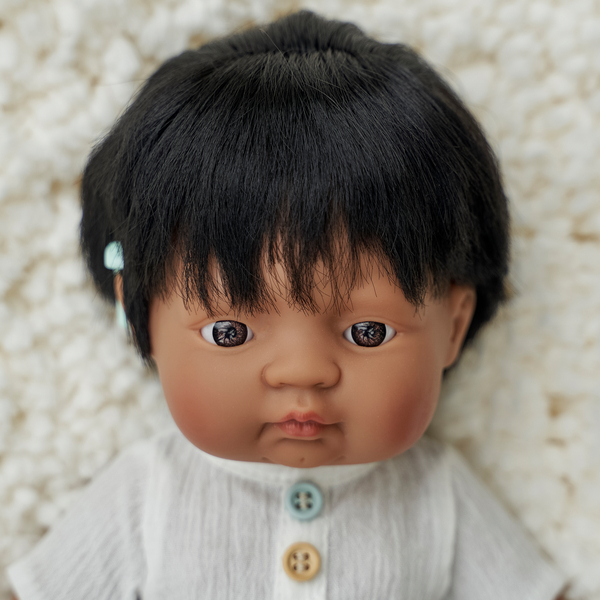 baby doll, doll face, black hair, knitted sweater, button detail