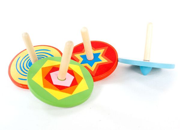 kauterspiel, holzkreisel, holzspielzeug, farbige kreisel, bunte scheibenkreisel
