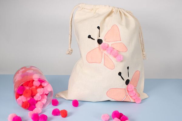 pom pom, pillow pouch, drawstring bag, butterfly design, pink decor